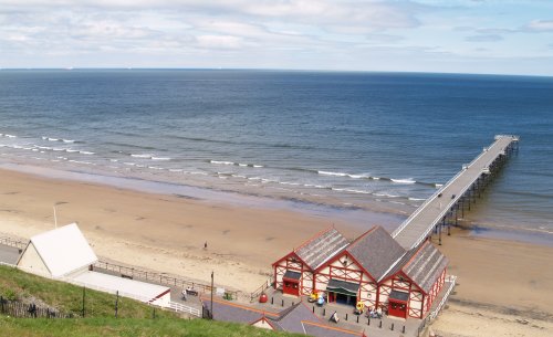 Saltburn Pier and the lower end of the cliff railway on the left.