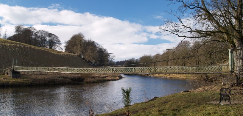 The footbridge Hebden suspension bridge of 1885 near Grassington to Linton over the River Wharfe Grassington, Wharfedale, North Yorkshire Dales National Park, England