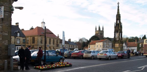 The Market Square in Helmsley, in the foreground is the Lord Faversham memorial and in the distance the tower of Helmsley Parish Church.