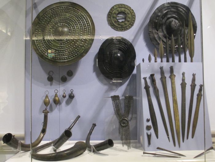 Later bronze age metal working and musical instruments (1200 - 500 BC), bronze swords, spears (spear heads), axes (axe heads) and shields and quite sophisticated casting techniques to produce bronze horns National Museum Ireland Archaeology Dublin