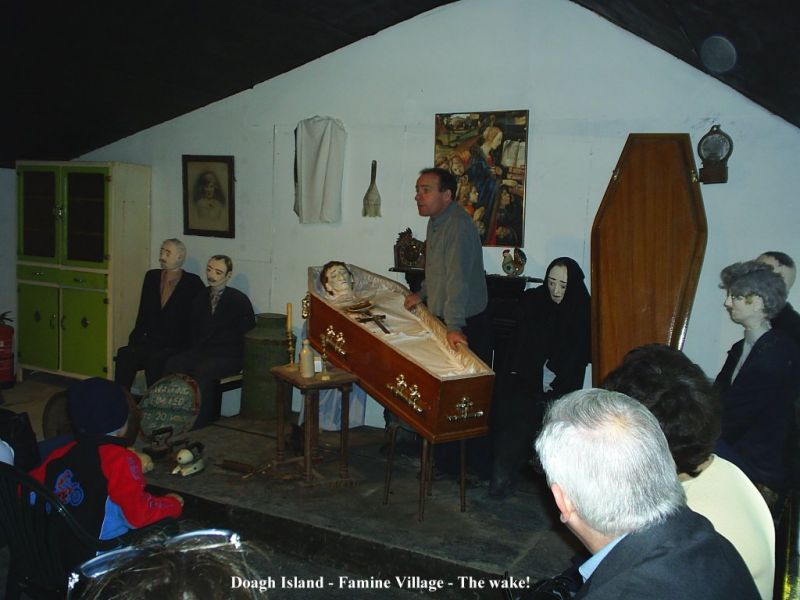 The wake, complete with 'professional' wailer on the right of the coffin.