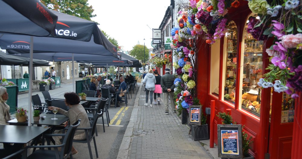 New Street, Malahide Village new look outdoor seating tables chairs for people to dine outside in fresh air cafe or restaurant style.