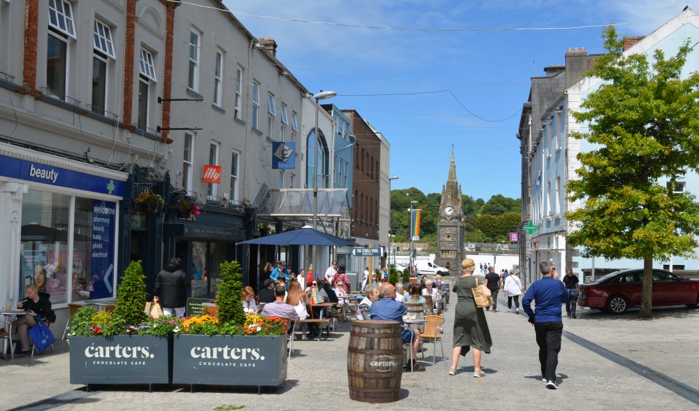 Carter's Chocolate Cafe, looking down Barronstrand Street to the 'Gothic Revival' Clock Tower on Waterford's Quay Waterford Town: James Roberts Square, looking down to the Clock Tower on waterfront of the River Suir, Ireland