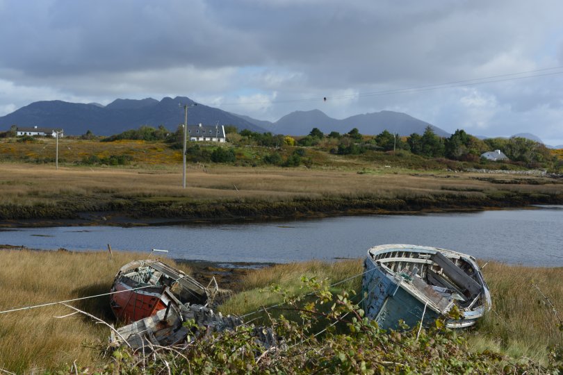 rather scenic backdrop to an old boat graveyard on Inishnee Inish Nii Inish Nee Inishnee Loop Walk, Connemara, Co. Galway, Ireland