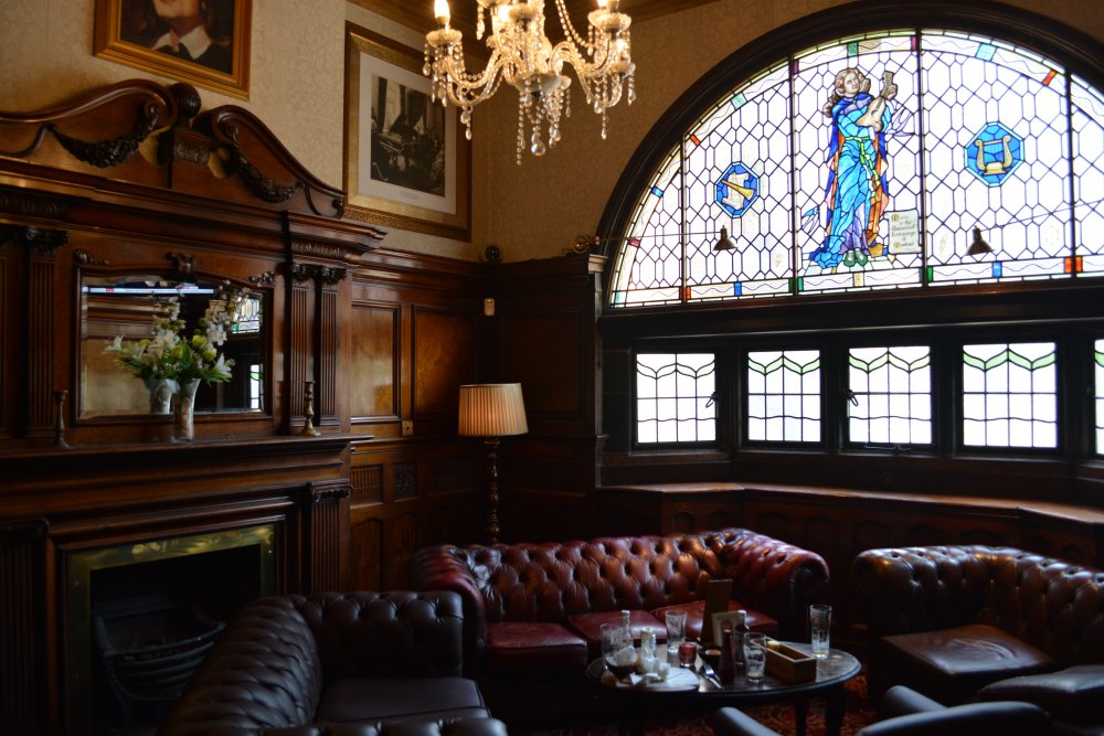 Liverpool's splendid interior of the 'Philharmonic pub' and lovely stained glass with a musical theme, and cosy chairs and sofas to relax in.