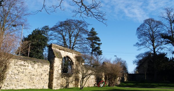 The front wall and old (sealed) gateway of the Old Lodge Hotel.
