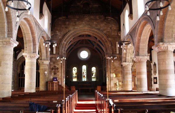 Looking down the nave to the altar in St Michael's Church. Note the wonderful Norman arches down the aisles and above the entrance to the chancel.