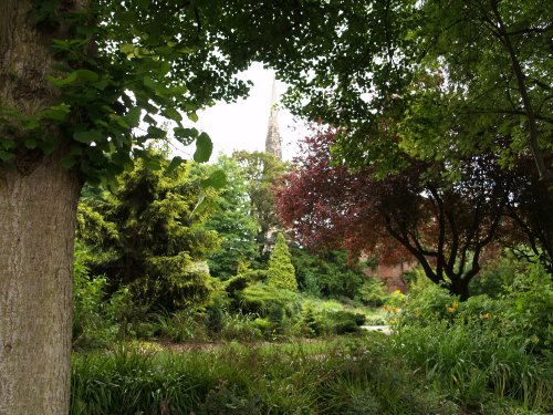 Castle Gardens overlooked by the tall spire of the Church of St Mary de Castro.