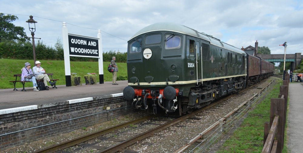 Class 24 Bo-Bo diesel locomotive D5054 with a demonstration freight train passing south through Quorn and Woodhouse station, Great Central Railway heritage weekend 'Railways at Work' (GCR August 2023)