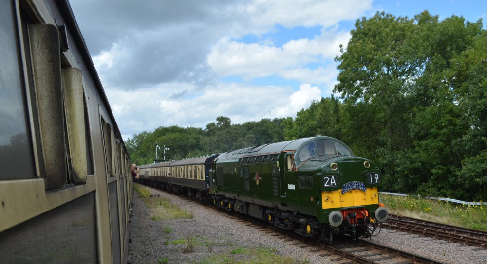 Class 37 diesel locomotive D6700 carrying the head board THE SOUTH YORKSHIREMAN, entering the loop at Swithland Sidings with a passenger service from Loughborough Central to Leicester North, Great Central Railway heritage weekend Gala 'Railways at Work' (GCR August 2023)