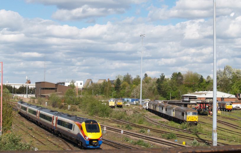 Trainspotting by the UK Rail Leasing yard, Leicester, a Class 222 DMU East Midlands express trains approaching Leicester station with trains from Sheffield and Derby for London St Pancras.