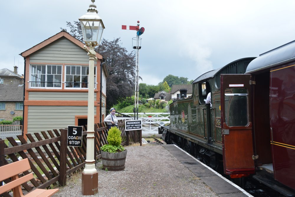Steam locomotive waiting to turn round the loop at Parkend station, by the level crossing Dean Forest Railway Gloucestershire England
