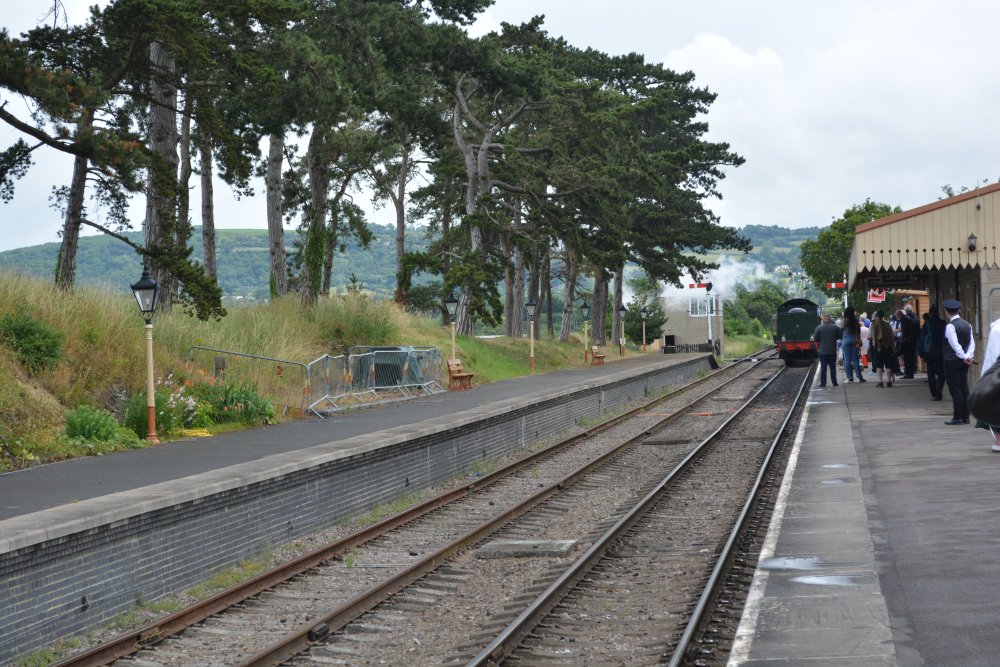 steam train pulling into Cheltenham Race Course station to pick up passengers Gloucestershire Warwickshire steam railway England