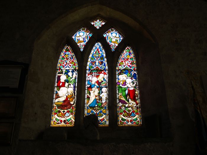 One of the stained glass windows of St Andrew's. The first church was probably built around 674 AD by St Wilfrid's artisans and monks using stone from the ruins of Corstopitum (Roman Corbridge).