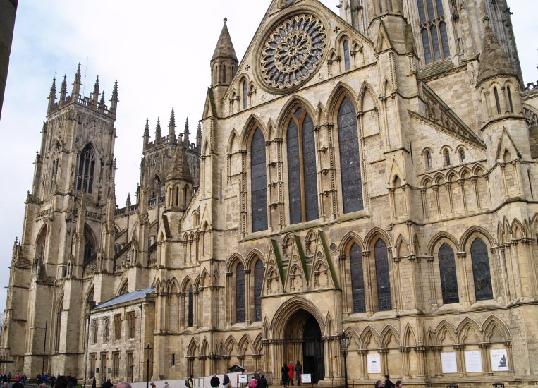 35. The south view of York Minster. On the left the twin west towers and at top right the famous restored Rose Window after the disastrous fire.