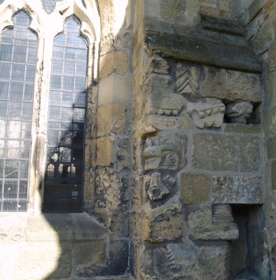 Odd bits of earlier stonework set in the wall
