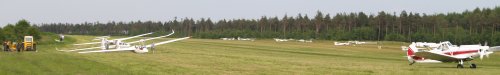 back to the aerodrome with the gliders lined up on the left to be towed up by the piper light aircraft