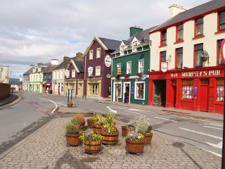 Dingle, Dingle Peninsula, Co. Kerry, Ireland, is bustling tourist town and a busy and attractive harbour setting with many colourful houses and interesting shops and innumerable places to eat.