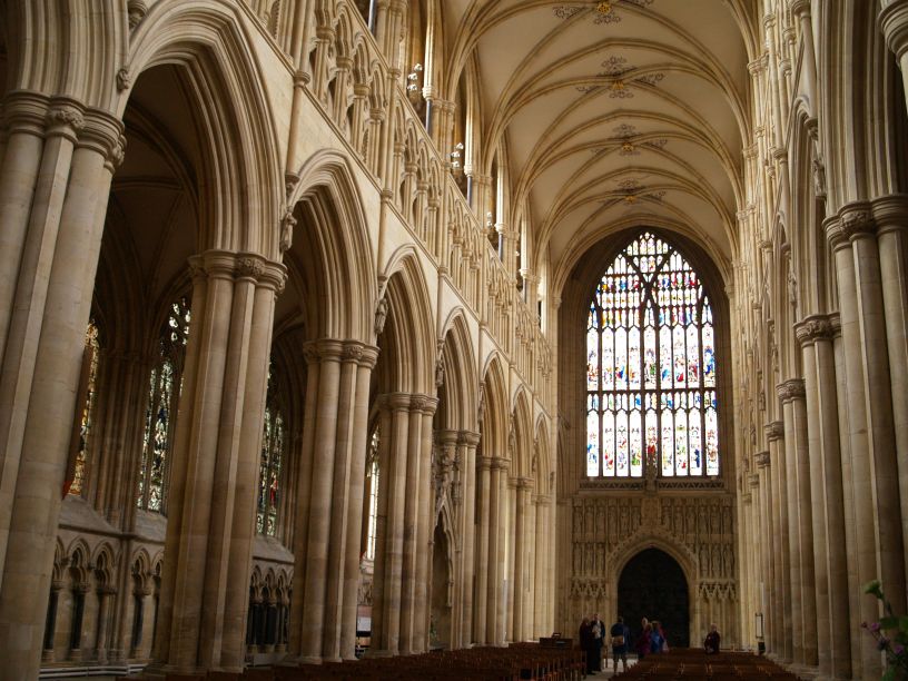 Looking west down the nave of Beverley Minster to the large stained glass west window