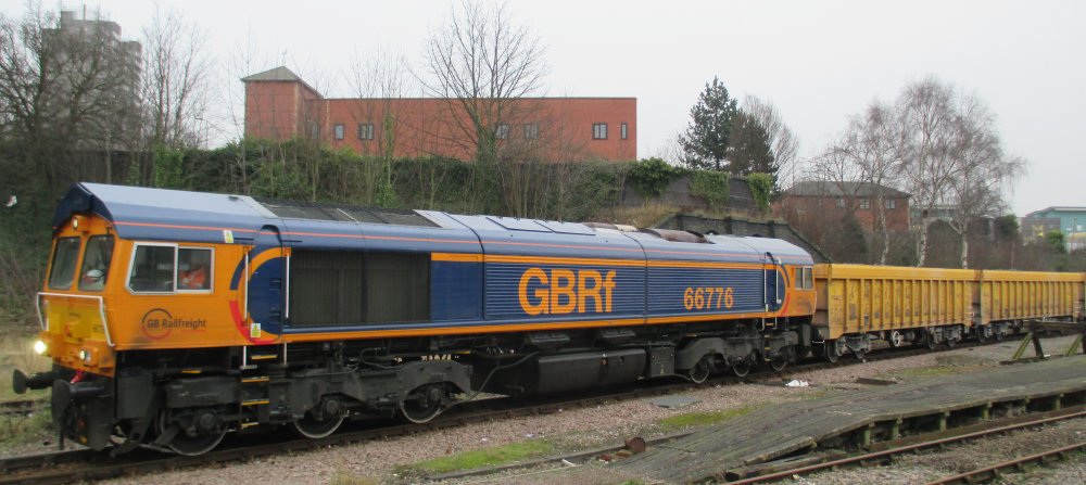 GBRf Class 66 diesel  hauling a Network Rail train of ballast wagons north-east through Leicester station heading for Whitemore recycling plant (Trainspotting 18/01/17)