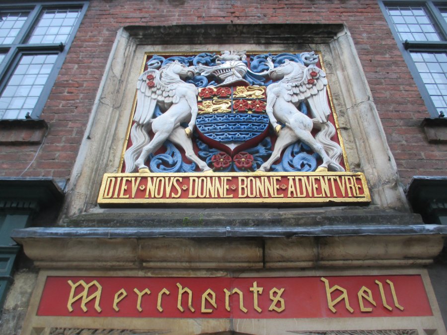 motto of coat of arms Merchants Hall, York, DIEU NOUS DONNE BONNE ADVENTURE