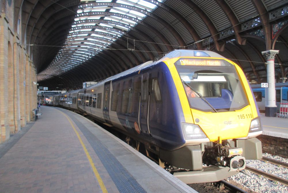 Class 195 DMU 195119 waiting to depart from York Station with a Northern rail service to Blackpool North