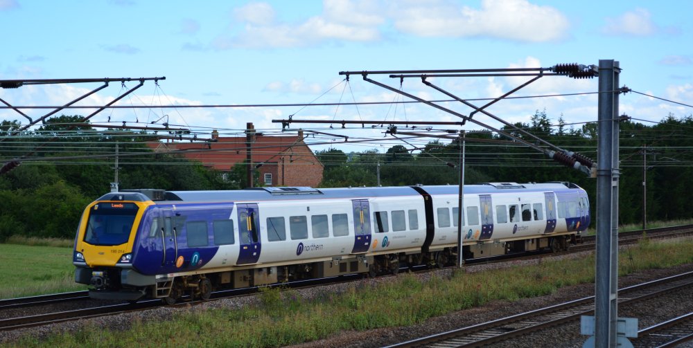Class 195 DMU 195014 with the 1008 Northern Rail service from York to  Leeds trainspotting Colton Junction footbridge