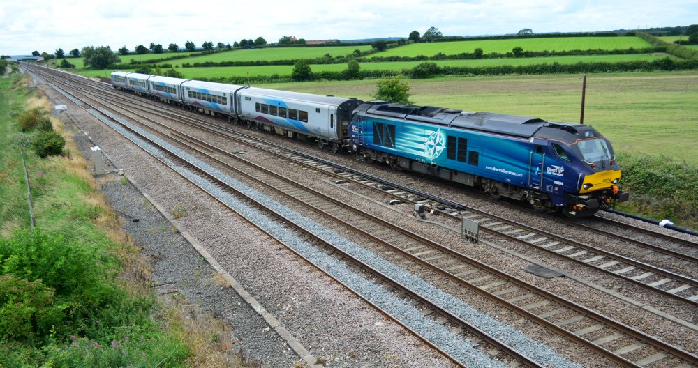 Trainspotting Colton Junction Class 68 diesel locomotive 68034 in DRS livery, heading the 1154 TransPennine service from Liverpool Lime Street to Scarborough trainspotting Colton Lane road bridge