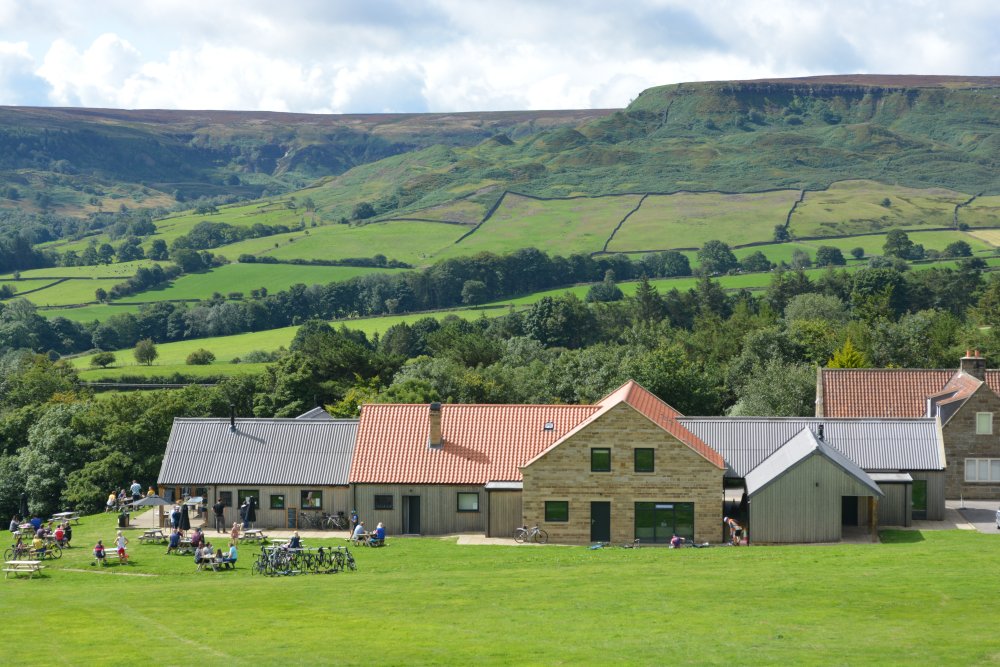 wonderful setting of the Yorkshire Cycle Hub Centre Cafe in Fryup Dale - looking up to Dale Head, North Yorkshire, England