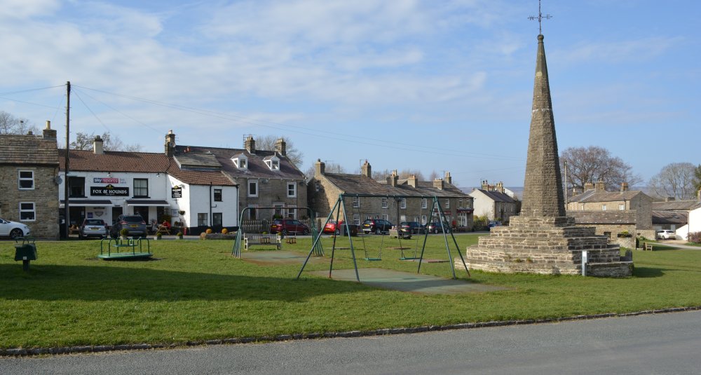 Fox and Hounds pub and Obelisk on the Green, West Burton, Wensleydale, North Yorkshire