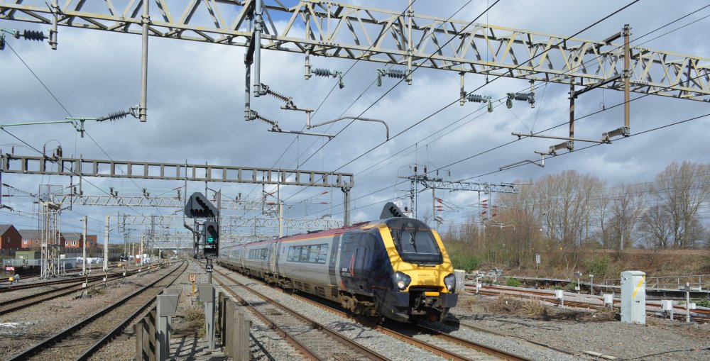 An unidentified Avanti West Coast Class 221 Super Voyager train heading south at speed through Nuneaton station with a Holyhead London Euston service (March 2023)