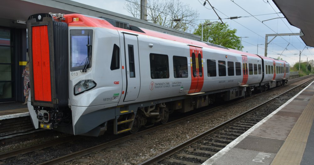 A CAF built diesel multiple 2-car unit Class 197 DMU unit 197013 at Newton-le-Willows station with Transport for Wales (TfW) service from Manchester to Llandudno Junction (April 2023)