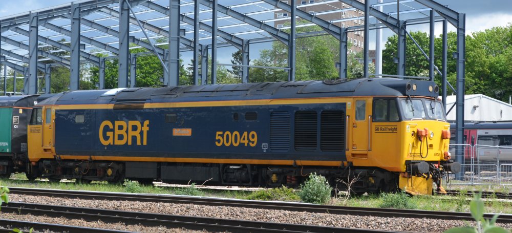 In the yard of UK Rail Leasing Leicester, GBRf (GB railfreight) operated Class 50 diesel-electric locomotive 50049 Defiance (May 2023)
