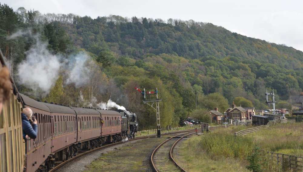 Steam locomotive 92134 approaching Levisham Station with a North Yorkshire Moors Railway service from Grosmont to Pickering.